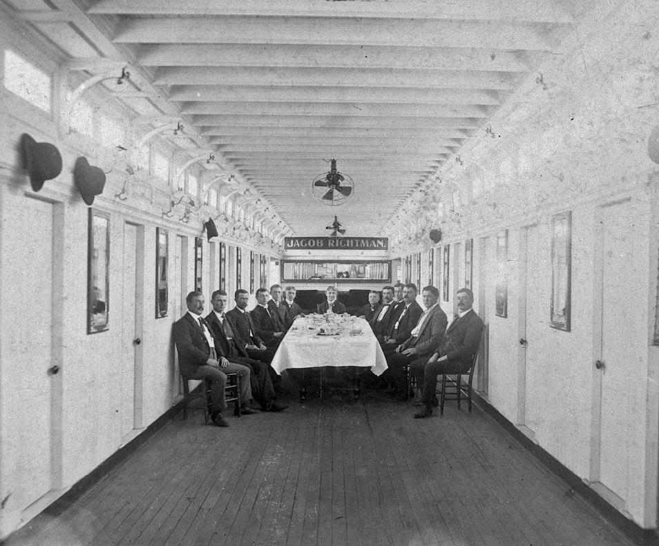 CabinJACOB_RICHTMAN_10gents2BoysSeatedAtTableForNORI