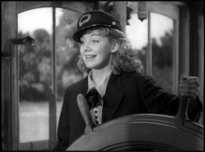 RoundTheBendSmilingFleetyBelleAtTheWheel